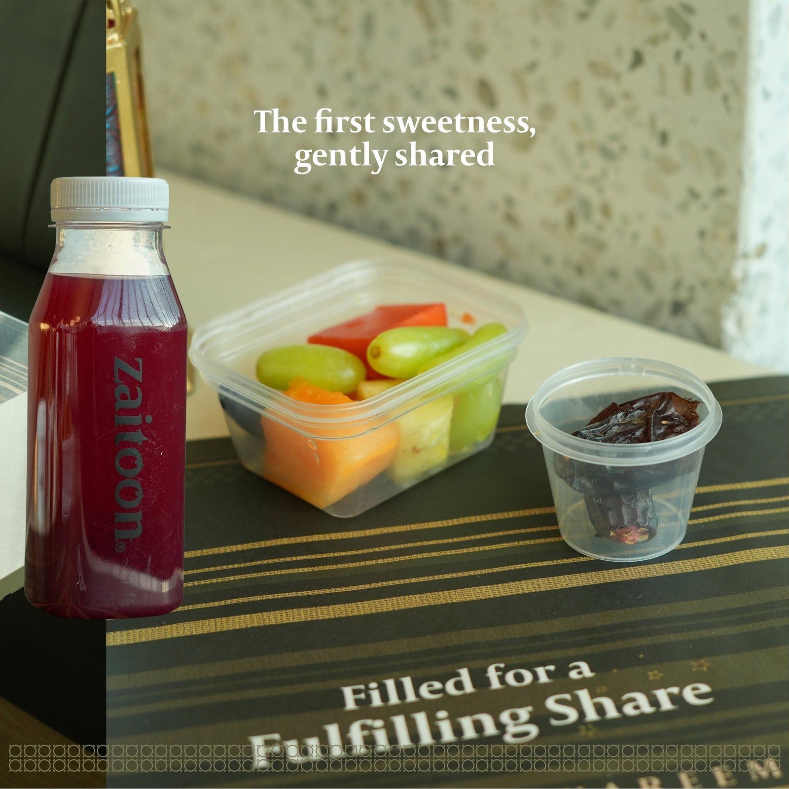 Iftar box with cut fruits, pomegranate cooler and dates